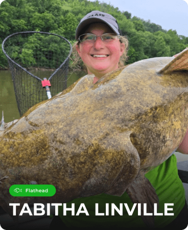 Tabitha Linville holding a fish caught using Catch The Fever® fishing rods.