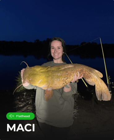 Maci holding a fish caught using Catch The Fever® fishing rods.