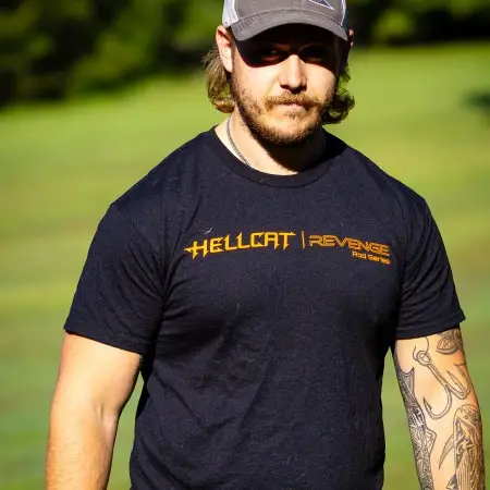 Man wearing Black Hellcat Revenge T-shirt with orange logo