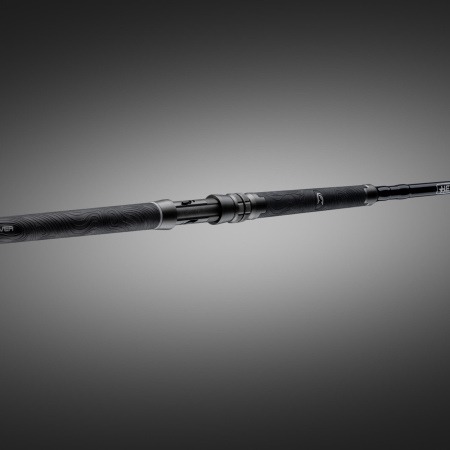 Angled full-view of the Hellcat Revenge Blackout Edition rod showing the grip, reel seat, and blank against a dark gradient background.